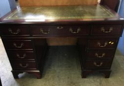 Mahogany pedestal desk with leather inset top