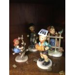 Four Hummel figures