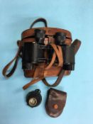 Pair of military issue binoculars and a compass