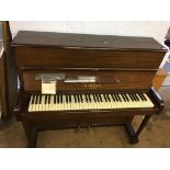 A short upright piano by W.H. Barnes of London