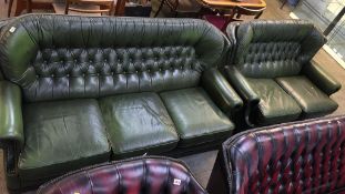 Two green leather button back sofas