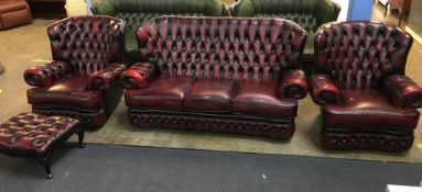 Oxblood leather button back three piece suite and footstool