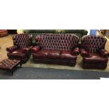 Oxblood leather button back three piece suite and footstool
