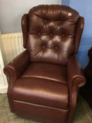 Leather button back reclining armchair