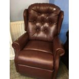 Leather button back reclining armchair