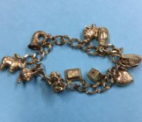 A 9ct gold charm bracelet, 17.7g