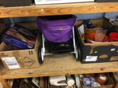 Shelf of assorted, including a pram