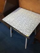 A 1950s melamine kitchen table