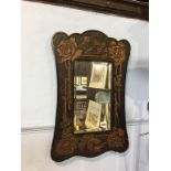 A carved floral framed mirror, 62 x 40cm