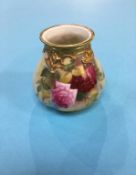 A Royal Worcester vase, decorated with flowers by E .M. Fildes