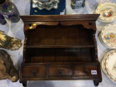 A miniature oak plate rack