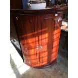 Mahogany bow front corner cabinet