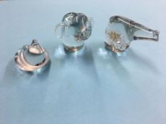 Three glass paperweights