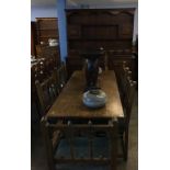 An oak dresser, refectory table and six chairs