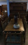 An oak dresser, refectory table and six chairs