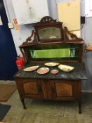 A mirror back tiled and marble top washstand
