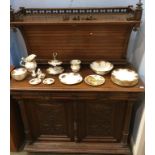 A Continental carved oak sideboard, with concave raised back