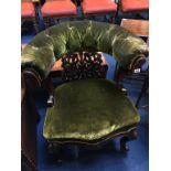 A late 19th century carved oak tub chair