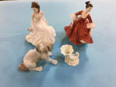 Two figures, a Nao dog, and a Royal Worcester shell