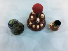 15 Royal Crown Derby thimbles and stand, a small Moorcroft vase and a glass vase