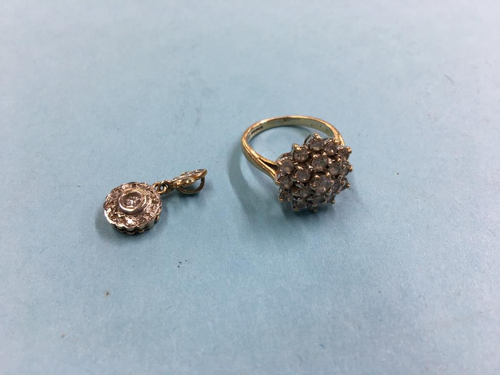 A 9ct cluster ring and a diamond mounted pendant, 4g