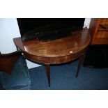 A 19th century mahogany demi lune hall table