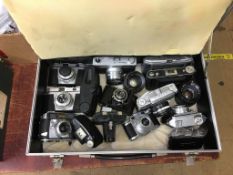 Collection of cameras including Comet, Balda etc., in a flight case