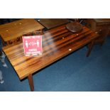 A rosewood veneered McIntosh and Co. coffee table