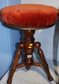 A mahogany circular stool
