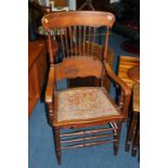 An oak carver chair with spindle back