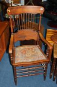 An oak carver chair with spindle back