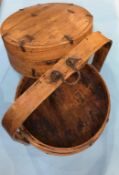 A Continental treen circular two tier food carrier