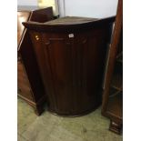 A 19th century mahogany hanging corner cabinet