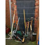 Large quantity of gardening tools including a hose reel, bin etc.