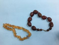 Two amber coloured bead necklaces