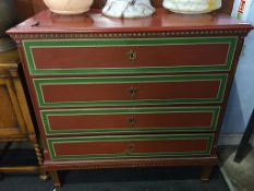 A red painted Continental pine chest of four long drawers