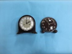 An oak 1930s circular dial clock and a Smith Bakelite clock