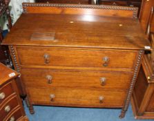 An oak chest of three drawers