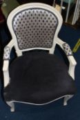 A cream painted carver chair, with grey upholstery