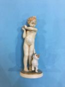 A small Royal Dux figure of a boy holding a ball with a cat at his side, number 3313, 18cm high