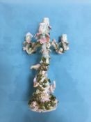 A German porcelain three branch candelabra, number 449, impressed marks, 36cm high