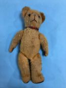 A plush straw filled and jointed teddy bear, 45cm length
