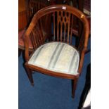 An Edwardian mahogany tub chair