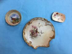 A Royal Worcester plate, with puce marks and two Worcester dishes