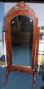 A reproduction mahogany cheval mirror