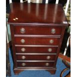 A reproduction mahogany chest of drawers
