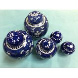 Five Chinese blue and white ginger jars and covers decorated with prunus and blossoms, 20cm, 14cm