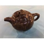 A terracotta Chinese teapot