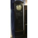 A 1930s oak long case clock