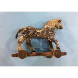 A distressed pull along wooden horse on wheels, 21cm wide